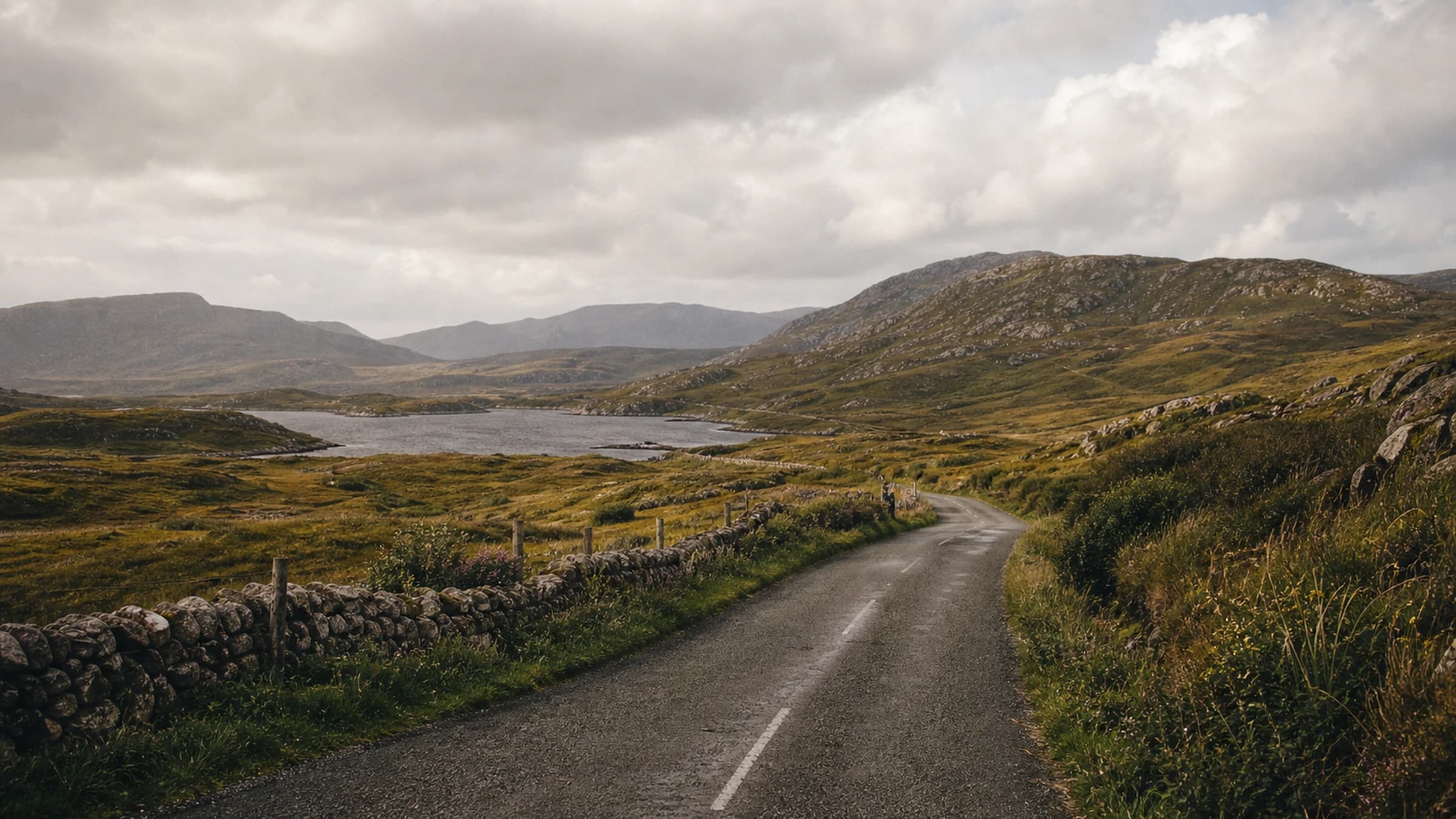 A narrow road between stone walls in the west of Ireland