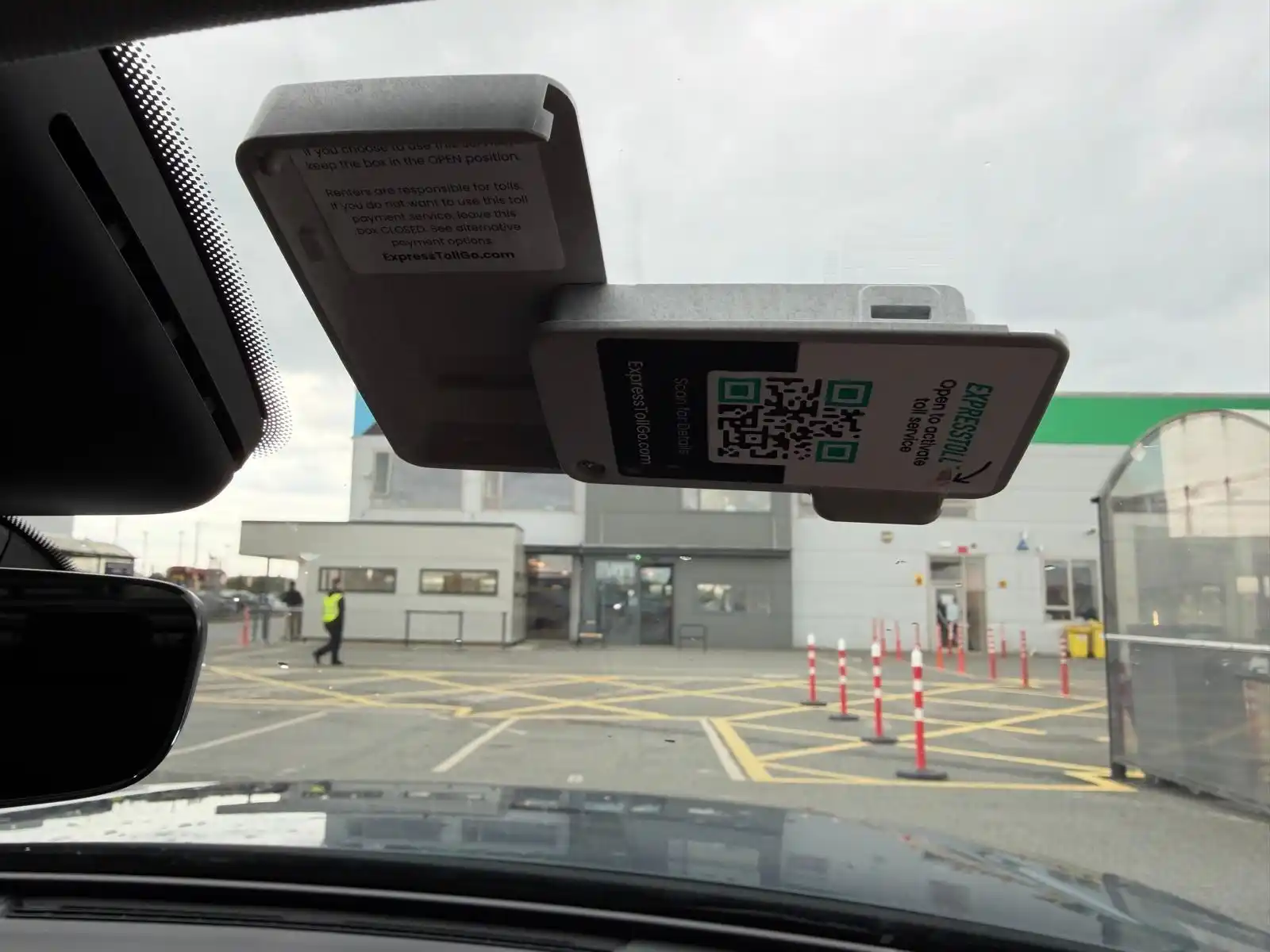 The toll tag box open, with the front cover swung out to the right and still attached at the hinge.
